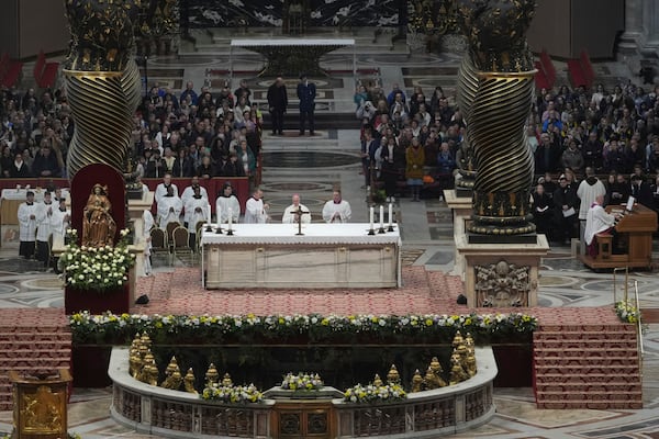 Archbishop Rino Fisichella, center, celebrates a mass for the jubilee of deacons Sunday, Feb. 23, 2025, in St. Peter's Basilica at The Vatican that was supposed to be presided over by Pope Francis who was admitted over a week ago at Rome's Agostino Gemelli Polyclinic and is in critical conditions. (AP Photo/Alessandra Tarantino)