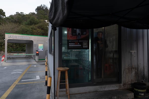 A taxi driver visits a rest stop near a first generation battery swap station by China-based CATL battery manufacturing company, in Xiamen, Fujian province, China, Wednesday, Dec. 18, 2024. (AP Photo/Ng Han Guan)