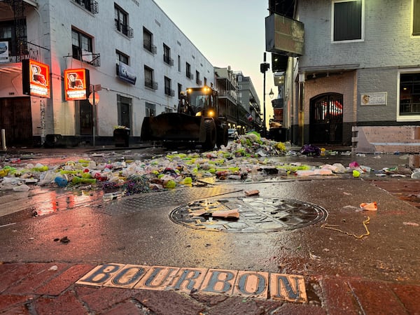 Waste from Mardi Gras scattered across infamous party spot Bourbon Street in New Orleans, on Ash Wednesday, March 5, 2025. (AP Photo/Jack Brook)