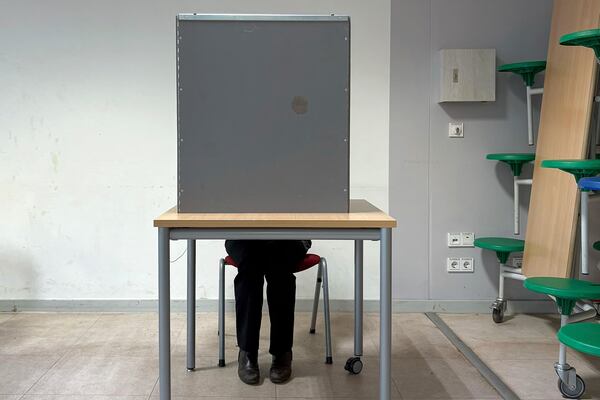 Gesa Schoenwolff casts her vote at a polling station in Berlin, Germany, Sunday, Sept. 23, 2025, during the German national election. (AP Photo/Philipp-Moritz Jenne)