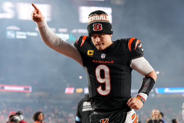 Cincinnati Bengals quarterback Joe Burrow (9) celebrates after an NFL football game against the Denver Broncos in Cincinnati, Saturday, Dec. 28, 2024. (AP Photo/Jeff Dean)