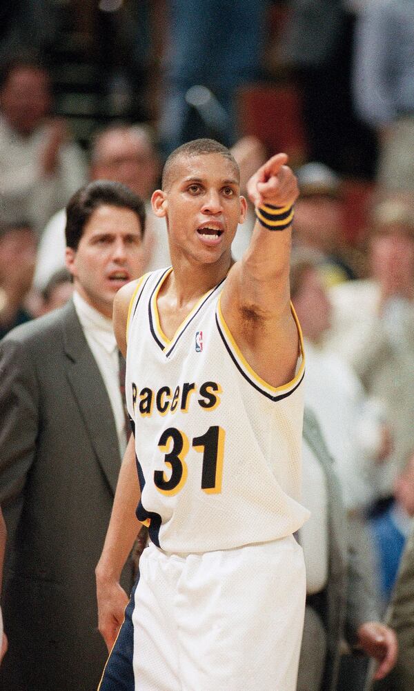 FILE - Indian Pacers' Reggie Miller (31) does a little trash talking in the direction of the New York Knicks as he leaves the court late in the fourth quarter during Game 3 of the first round of the NBA Playoffs in Indianapolis, May 5, 1993. (AP Photo/Ron Hoskins, File)