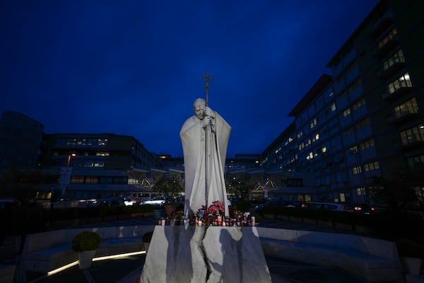 A statue of Pope John Paul II is seen in front of the Agostino Gemelli Polyclinic, Rome, Wednesday, Feb. 19, 2025, where the Pontiff is hospitalized since Friday, Feb. 14. (AP Photo/Andrew Medichini)