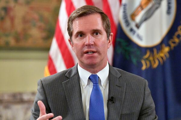 Kentucky Gov. Andy Beshear talks about the gains in the economic growth f the state during the past year in Frankfort, Ky., Wednesday, Dec. 18, 2024. (AP Photo/Timothy D. Easley)