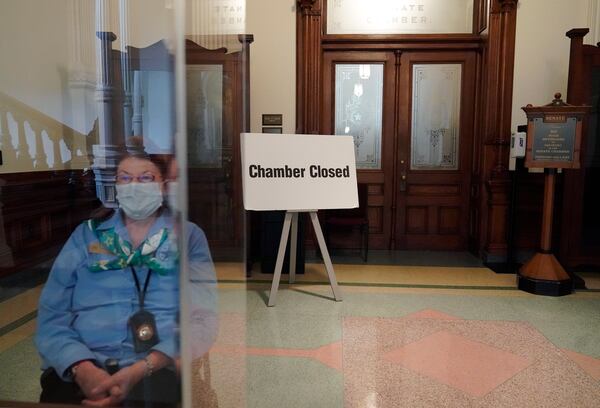 FILE - A "Chamber Closed" sign stands at the entry to the Senate floor at the State Capitol, in Austin, Texas, June 1, 2021. The Texas Legislature closed out its regular session Monday, but are expected to return for a special session after Texas Democrats blocked one of the nation's most restrictive new voting laws with a walkout. (AP Photo/Eric Gay, File)