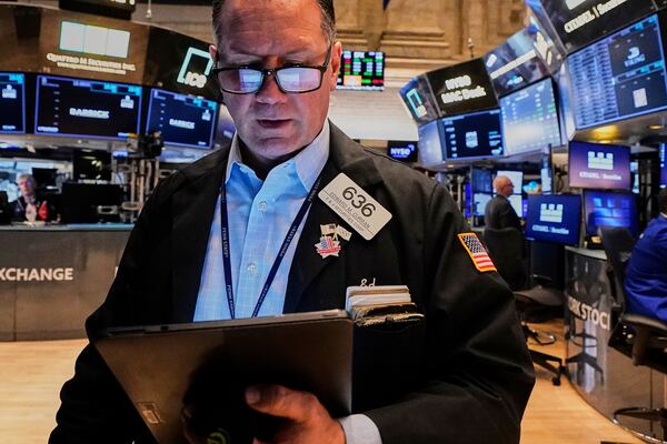 Trader Edward Curran works on the floor of the New York Stock Exchange, Friday, May 9, 2025. (AP Photo/Richard Drew)
