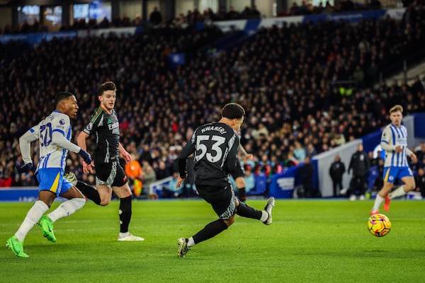 Arsenal's Ethan Nwaneri scores the opening goal during the English Premier League soccer match between Brighton and Hove Albion FC and Arsenal at the Amex stadium in Brighton, Saturday, Jan. 4, 2025. (AP Photo/Ian Walton)