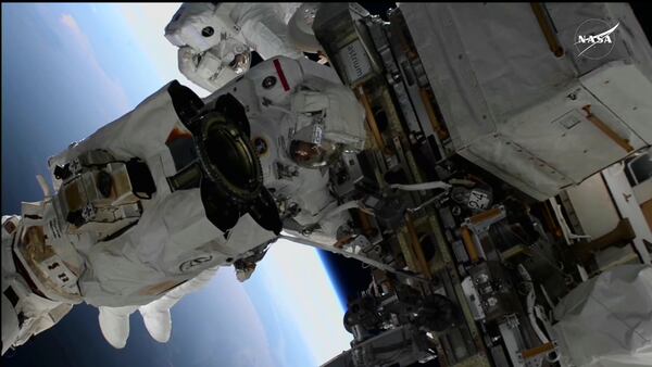 In this image, made from NASA TV, US astronauts Suni Williams, foreground, and Butch Wilmore, behind, work outside the International Space Station during a spacewalk, Thursday, Jan. 30, 2025. (AP Photo/NASA TV)