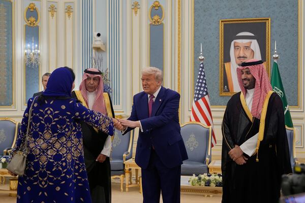 President Donald Trump greets Reema bint Bandar Al Saud, Saudi ambassador to the United States, at the Royal Palace in Riyadh, Saudi Arabia, Tuesday, May 13, 2025 (AP Photo/Alex Brandon)