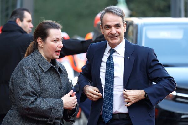 Greece's Prime Minister Kyriakos Mitsotakis, right, arrives for an EU summit at the Egmont Palace in Brussels, Monday, Feb. 3, 2025. (AP Photo/Geert Vanden Wijngaert)