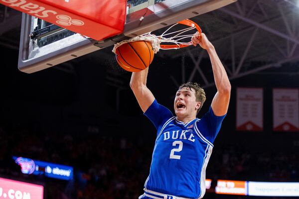 Clemson guard Dillon Hunter (2) dunks against Clemson during the first half of an NCAA college basketball game on Saturday, Feb. 8, 2025, in Clemson, S.C. (AP Photo/Scott Kinser)