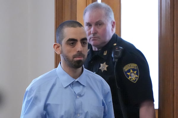 Hadi Matar is escorted into the courtroom at the Chautauqua County Courthouse ahead of the second day in his trial, Tuesday, Feb. 11, 2025, in Mayville, N.Y. Matar is charged with stabbing famed author Salman Rushdie. (AP Photo/Gene J. Puskar)