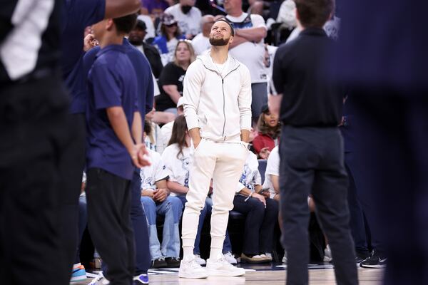 Golden State Warriors' Stephen Curry squints at the scoreboard in 2nd quarter against Minnesota Timberwolves in NBA Western Conference Semifinals' Game 5 at Target Center in Minneapolis on Wednesday, May 14, 2025. (Scott Strazzante/San Francisco Chronicle via AP)