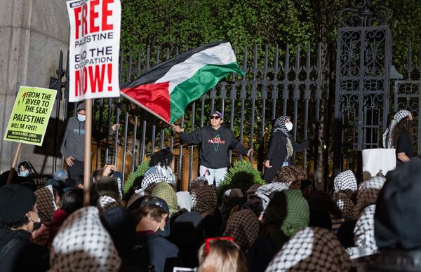 FILE - Pro-Palestinian protesters gather near a main gate at Columbia University in New York, Tuesday, April 30, 2024, just before New York City police officers cleared the area after a building was taken over by protesters earlier in the day. (AP Photo/Craig Ruttle, FIle)