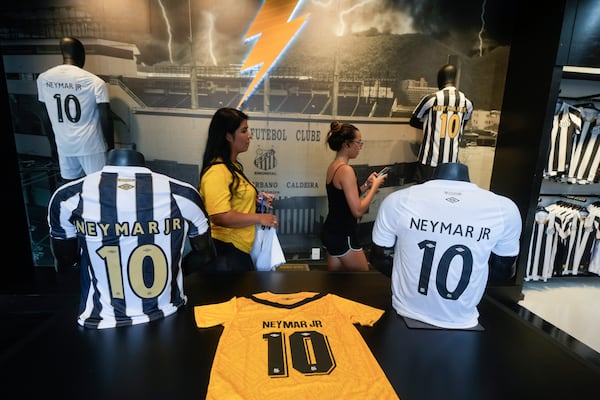 Jerseys of Brazilian soccer player Neymar are displayed at the Santos FC club store at Vila Belmiro Stadium before A ceremony presenting him as the club's new player in Santos, Brazil, Friday, Jan. 31, 2025. (AP Photo/Andre Penner)