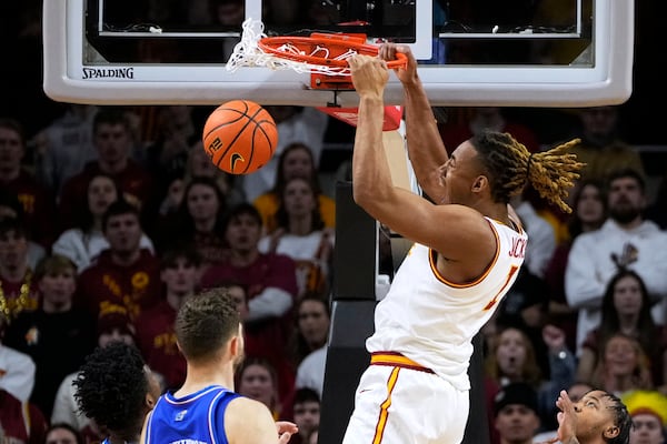 Iowa State center Dishon Jackson (1) dunks the ball during the first half of an NCAA college basketball game against Kansas Wednesday, Jan. 15, 2025, in Ames, Iowa. (AP Photo/Charlie Neibergall)