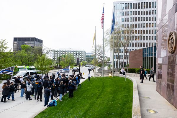 Family members of former Grand Rapids Police officer Christopher Schurr enter the Kent County Courthouse as supporters gather outside in Grand Rapids, Mich. on Friday, May 2, 2025. (Joel Bissell /Kalamazoo Gazette via AP)