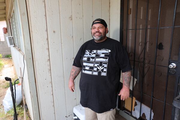 Joshua Kamalo, 43, speaks at his home about his election ordeal after his mail-in ballot was rejected by Maui County stating they couldn't verify his signature, Wednesday, Dec. 18, 2024, in Kahului, Hawaii. (AP Photo/Marco Garcia)