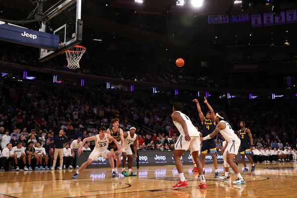 Marquette guard Stevie Mitchell (4) shoots a free throw during the second half of an NCAA college basketball game against Xavier in the quarterfinals of the Big East Conference tournament, Thursday, March 13, 2025, in New York. (AP Photo/Pamela Smith)