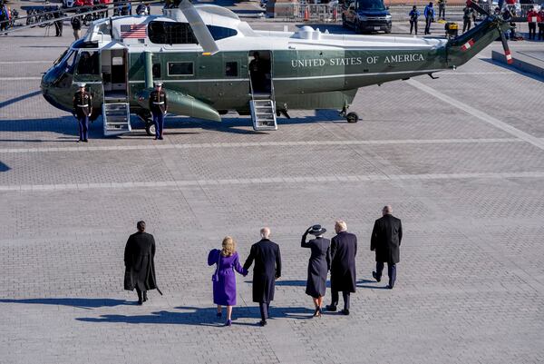 President Donald Trump, from second right, and first lady Melania Trump walk with former President Joe Biden and Jill Biden to board a Marine helicopter as the Bidens depart to Joint Base Andrews after the 60th Presidential Inauguration, Monday, Jan. 20, 2025, at the U.S. Capitol in Washington. (Jack Gruber/Pool Photo via AP)