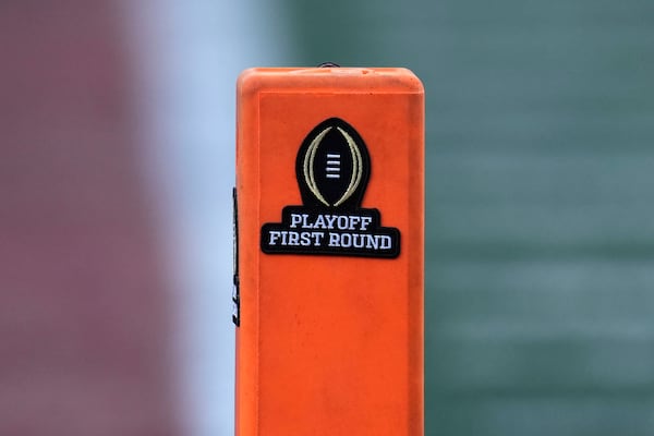 A playoff logo is seen on an end zone marker during the first half between Texas and Clemson in the first round of the College Football Playoff, Saturday, Dec. 21, 2024, in Austin, Texas. (AP Photo/Eric Gay)