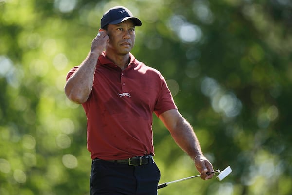 FILE - Tiger Woods walks to the green on the fifth hole during final round at the Masters golf tournament at Augusta National Golf Club Sunday, April 14, 2024, in Augusta, Ga. (AP Photo/Charlie Riedel, File)