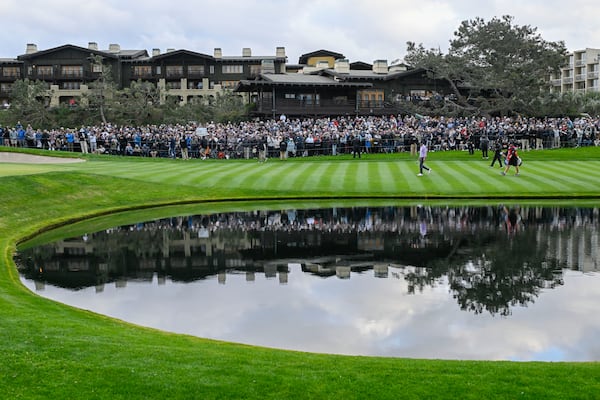 Harris English walks on the the 18th green on the South Course at Torrey Pines during the final round of the Farmers Insurance Open golf tournament Saturday, Jan. 25, 2025, in San Diego. (AP Photo/Denis Poroy)