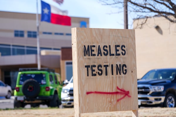 FILE -A sign is seen outside of Seminole Hospital District offering measles testing, Feb. 21, 2025, in Seminole, Texas. (AP Photo/Julio Cortez), File)