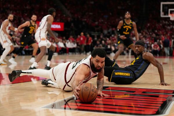 Houston Rockets' Fred VanVleet (5) reaches for a loose ball in front of Golden State Warriors' Jimmy Butler III during the second half of Game 7 of an NBA basketball first-round playoff series Sunday, May 4, 2025, in Houston. (AP Photo/Ashley Landis)