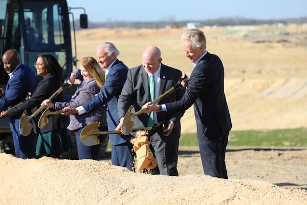 South Carolina Republican Gov. Henry McMaster, left, state Department of Transportation Secretary Justin Powell, center, and Scout Motors CEO Scott Keogh, right, attend a groundbreaking for a new interstate exit for the Scout Motors plant on Monday, Feb. 3, 2025, in Blythewood, S.C. (AP Photo/Jeffrey Collins)