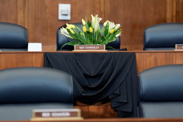 Flowers are seen at the seat of Rep. Gerald Connolly, D-Va., before the start of a House Committee on Foreign Affairs hearing, Wednesday, May 21, 2025, in Washington. Connolly, a Democratic congressman and fixture of Virginia politics, has died at 75. (AP Photo/Mark Schiefelbein)