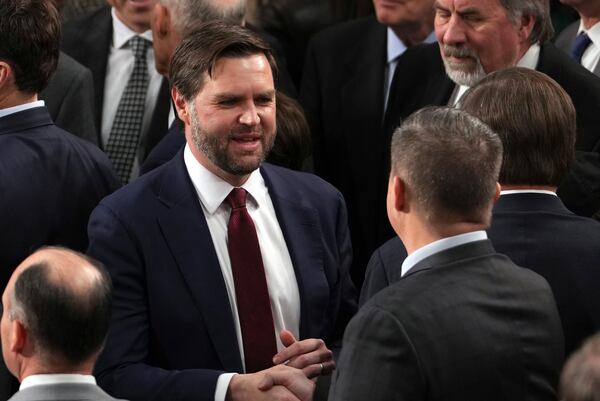 Vice President-elect JD Vance is congratulated after a joint session of Congress confirmed the Electoral College votes, affirming President-elect Donald Trump's victory in the presidential election, Monday, Jan. 6, 2025, at the U.S. Capitol in Washington. (AP Photo/Matt Rourke)