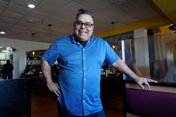 Raul Luis smiles for a photo at his Birrieria Chalio Mexican Restaurant in Fort Worth, Texas, Thursday, Feb. 13, 2025. (AP Photo/LM Otero)