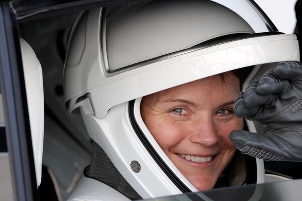 Astronaut Anne McClain leaves the Operations and Checkout building before heading to Launch Pad 39-A at the Kennedy Space Center in Cape Canaveral, Fla., for a mission to the International Space Station in Cape Canaveral, Fla., Friday, March 14, 2025. (AP Photo/Terry Renna)