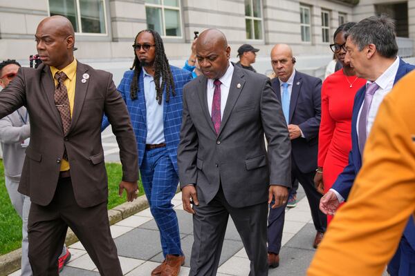 Mayor Ras Baraka, center, leaves after speaking to supporters and media after a court appearance in Newark, N.J., Thursday, May 15, 2025. (AP Photo/Seth Wenig)
