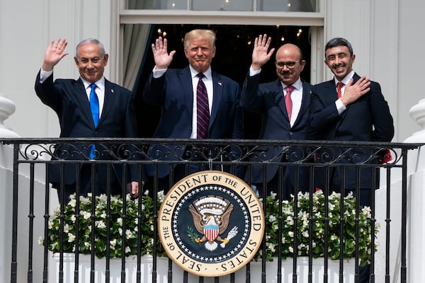 FILE - Israeli Prime Minister Benjamin Netanyahu, left, U.S. President Donald Trump, Bahrain Foreign Minister Khalid bin Ahmed Al Khalifa and United Arab Emirates Foreign Minister Abdullah bin Zayed al-Nahyan pose for a photo on the Blue Room Balcony after signing the Abraham Accords at the White House in Washington, Sept. 15, 2020. (AP Photo/Alex Brandon, File)