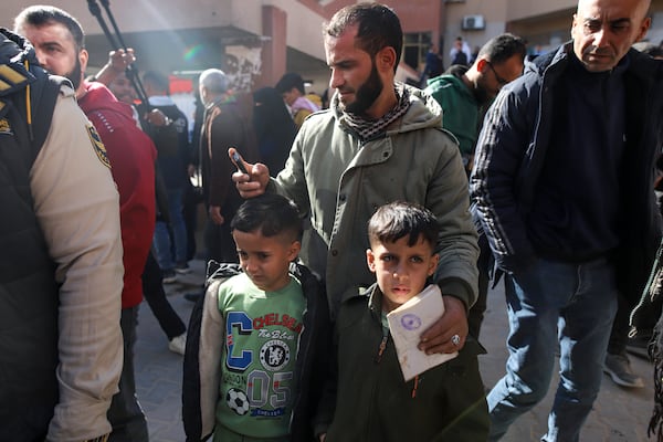 Palestinians wounded in the Israeli bombardment of the Gaza Strip wait before crossing the Rafah border into Egypt, as wounded and sick Palestinians are allowed to leave the Gaza Strip for medical treatment, in Khan Younis, Saturday Feb. 1, 2025. (AP Photo/Jehad Alshrafi)