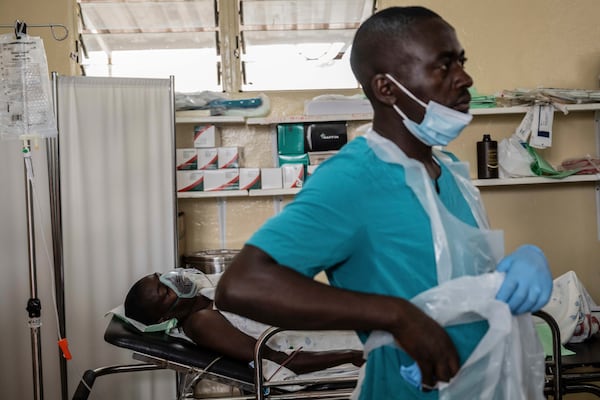 A person wounded in the fighting between M23 rebels and Congolese armed forces arrives at the Cbeca Ndosho hospital in Goma, Democratic Republic of the Congo, Thursday, Jan. 23, 2025. (AP Photo/Moses Sawasawa)