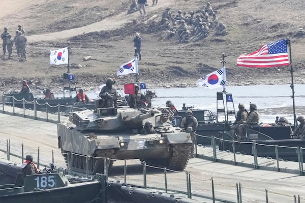 A South Korean army K1E1 tank crosses a floating bridge on the Imjin River during a joint river-crossing exercise between South Korea and the United States as a part of the Freedom Shield military exercise in Yeoncheon, South Korea, Thursday, March 20, 2025. (AP Photo/Ahn Young-joon)