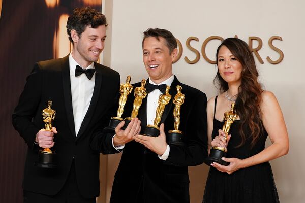 Alex Coco, from left, winner of the award for best picture for "Anora," Sean Baker, winner of the awards for best original screenplay, best film editing, best director, and best picture for "Anora," and Samantha Quan, winner of the award for best picture for "Anora," pose in the press room at the Oscars on Sunday, March 2, 2025, at the Dolby Theatre in Los Angeles. (Photo by Jordan Strauss/Invision/AP)