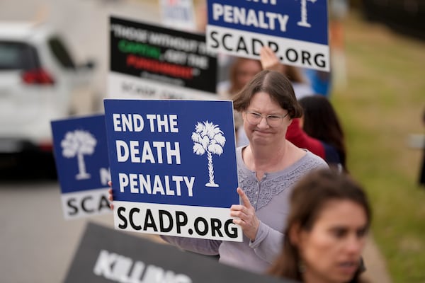 Vivian Lovingood protests the scheduled execution of South Carolina inmate Brad Sigmon, Friday, March 7, 2025, in Columbia, S.C. For the first time in 15 years a death row inmate in the U.S. will be executed by a firing squad. (AP Photo/Chris Carlson)