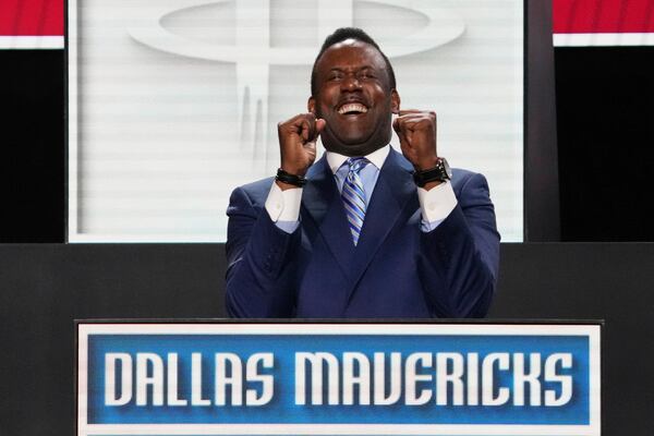 Dallas Mavericks' Rolando Blackman celebrates after NBA Deputy Commissioner Mark Tatum announced that the Mavericks won the first pick in the NBA basketball draft lottery in Chicago, Monday, May 12, 2025. (AP Photo/Nam Y. Huh)