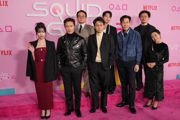 Jo Yu-ri, from left, Lee Byung-hun, Lee Seo-hwan, Hwang Dong-hyuk, Im Si-wan, Lee Jung-jae, Yang Dong-geun, and Kang Ae-sim arrive at the premiere of the second season of "Squid Game" on Thursday, Dec. 12, 2024, at Los Angeles City College in Los Angeles. (AP Photo/Chris Pizzello)