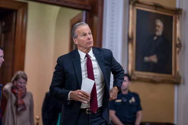 Senate Minority Whip John Thune, R-S.D., arrives to speak to reporters following a closed-door strategy session, at the Capitol in Washington, Tuesday, Dec. 17, 2024. (AP Photo/J. Scott Applewhite)