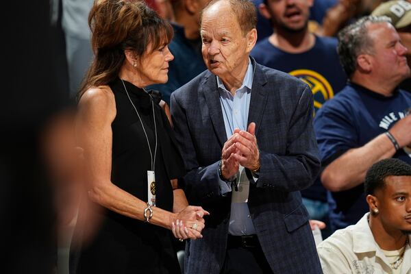 FILE - Minnesota Timberwolves owner Glen Taylor chats with his wife, Becky, in the second half of Game 1 of an NBA basketball second-round playoff series, May 4, 2024, in Denver. (AP Photo/David Zalubowski, File)