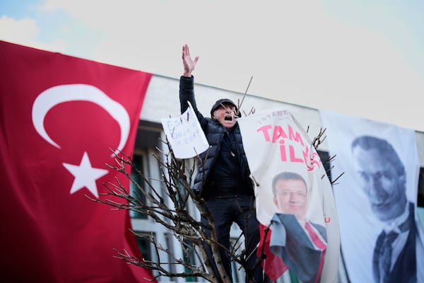 People gather outside the City Hall to protest the arrest of Istanbul Mayor Ekrem Imamoglu in Istanbul, Turkey, Wednesday, March 19, 2025. (AP Photo/Emrah Gurel)