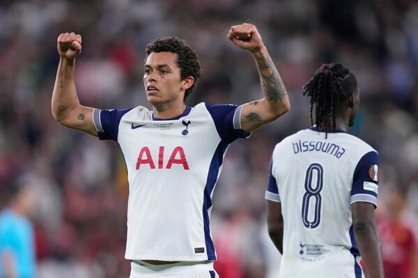 Tottenham's Brennan Johnson celebrates after scoring his side's opening goal during the Europa League final soccer match between Tottenham Hotspur and Manchester United at the San Mames Stadium in Bilbao, Spain, Wednesday, May 21, 2025. (AP Photo/Jose Breton)