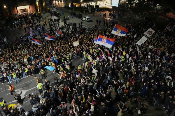 Protesters gather ahead of a major rally this weekend in downtown Belgrade, Serbia, Friday, March 14, 2025. (AP Photo/Darko Vojinovic)