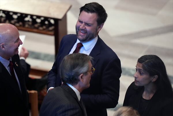 Vice President-elect JD Vance and his wife Usha Vance arrive before the state funeral for former President Jimmy Carter at Washington National Cathedral in Washington, Thursday, Jan. 9, 2025. (AP Photo/Jacquelyn Martin)