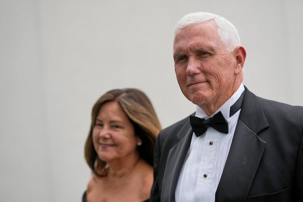 Former Vice President Mike Pence arrives with his wife, Karen Pence, at the JFK Library where he will receive the John F. Kennedy Profile in Courage Award, Sunday, May 4, 2025, in Boston. (AP Photo/Robert F. Bukaty)